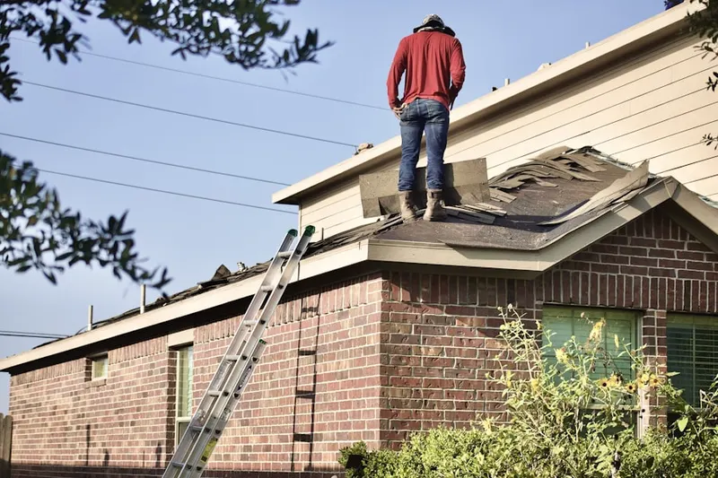 Professional roofer working on a residential roof in Holiday Harbor